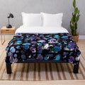 Cozy and plush mushroom-themed blanket in blue, lilac, and violet tones