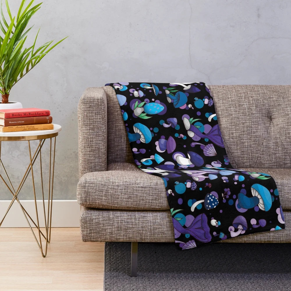 Cozy and plush mushroom-themed blanket in blue, lilac, and violet tones