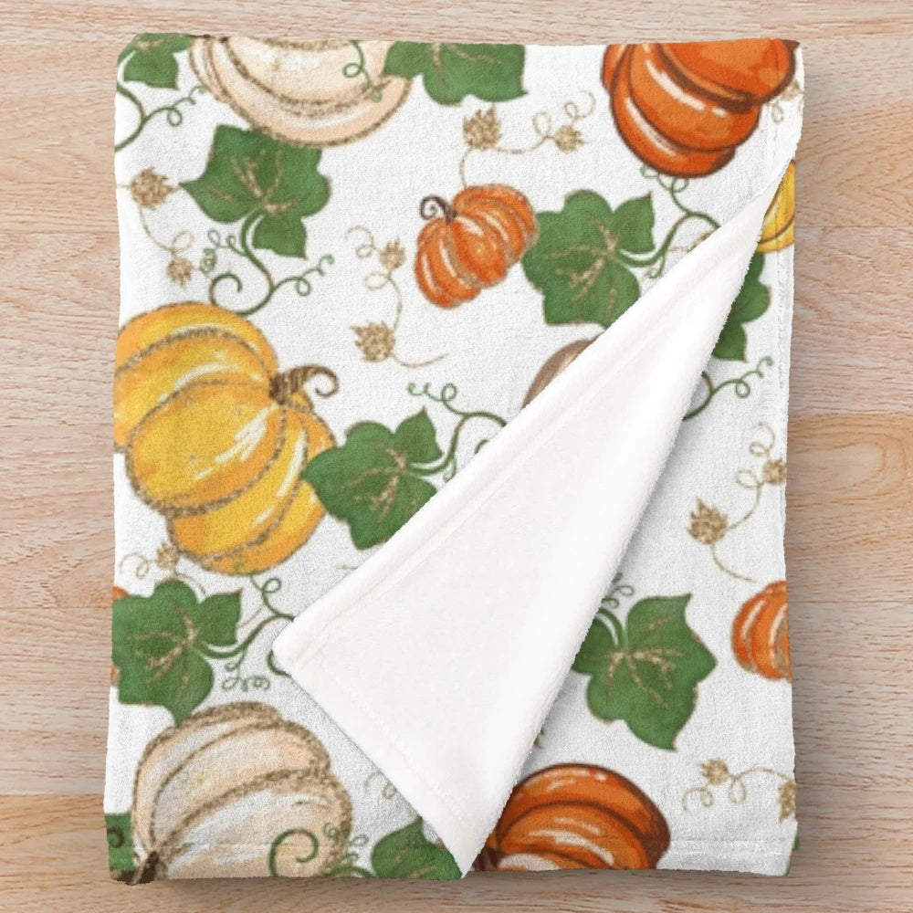 Plush blanket with a glittery pumpkin patch design, perfect for autumn
