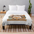 Plush blanket featuring a cozy autumn-themed hedgehog and forest animal design