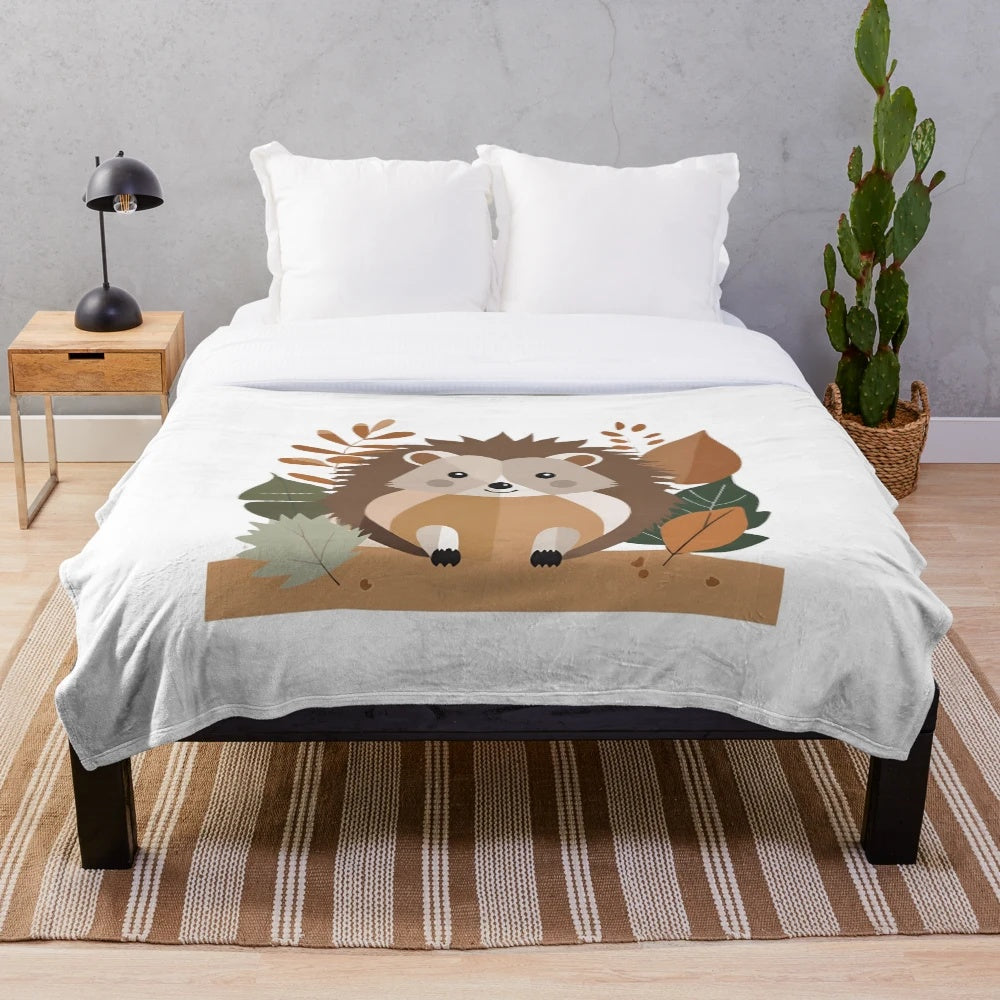 Plush blanket featuring a cozy autumn-themed hedgehog and forest animal design