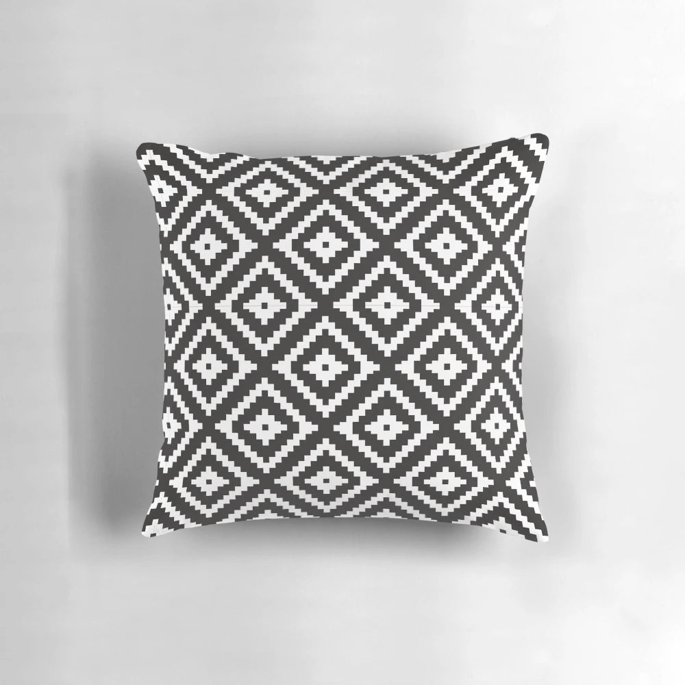 Aztec inspired black and white patterned throw pillow