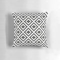 Aztec-inspired black and white throw pillow with tribal pattern design, perfect for modern farmhouse home decor.