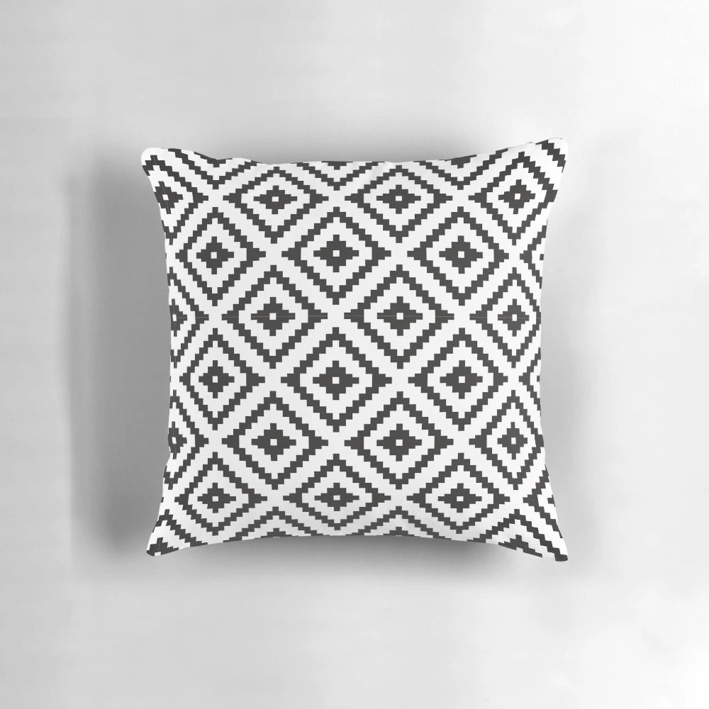 Aztec-inspired black and white throw pillow with tribal pattern design, perfect for modern farmhouse home decor.