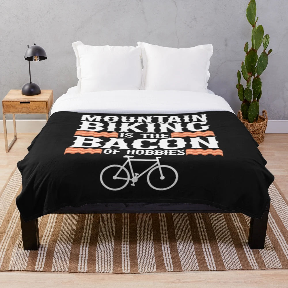 Mountain biking plush blanket with a bacon design