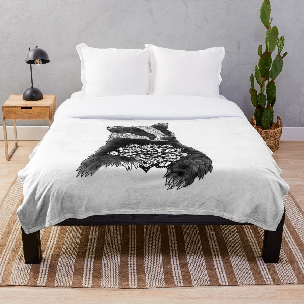Cozy plush blanket with a balanced mandala badger tattoo design in black and white dots and patterns
