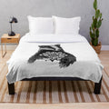 Cozy plush blanket with a balanced mandala badger tattoo design in black and white dots and patterns