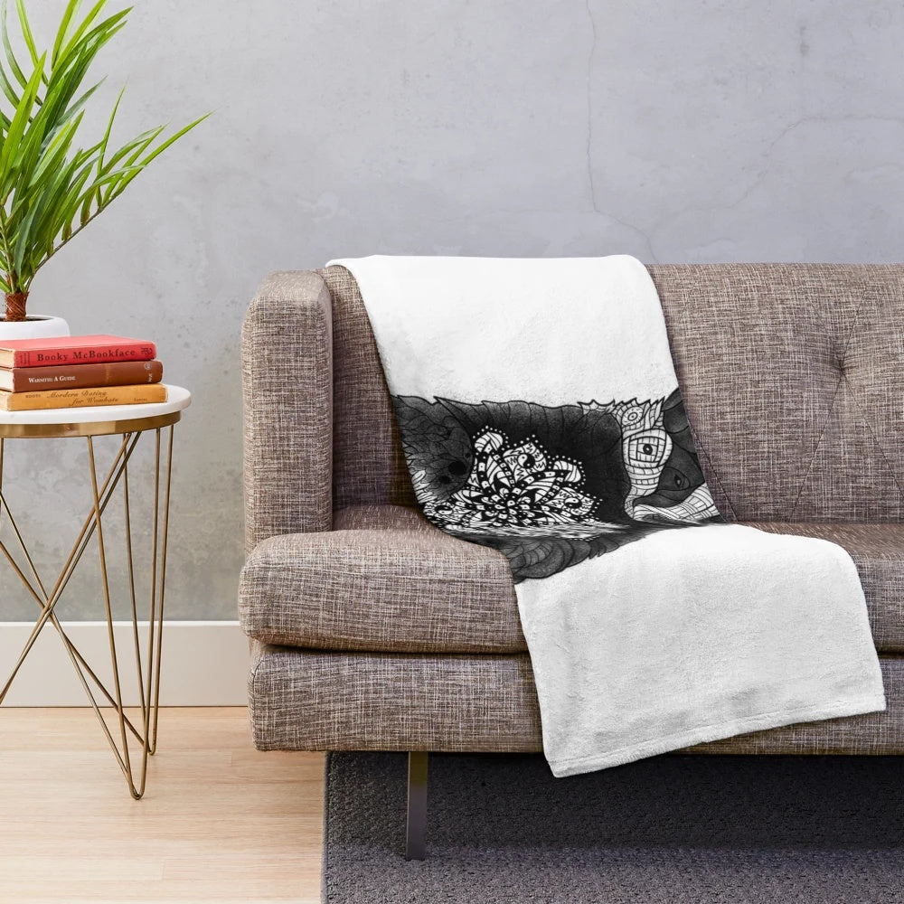 Cozy plush blanket with a balanced mandala badger tattoo design in black and white dots and patterns