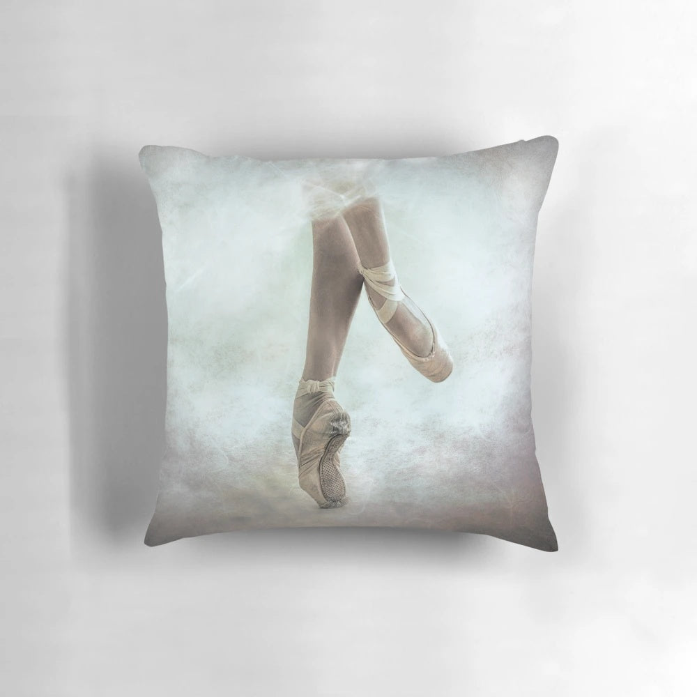 Ballerina Pique Pillow featuring a dancer in pointe shoes, tulle, and a textured, bokeh background.