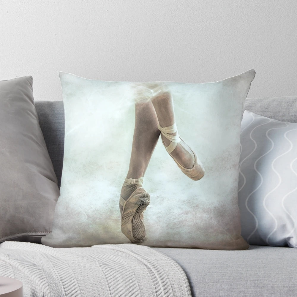Ballerina Pique Pillow featuring a dancer in pointe shoes, tulle, and a textured, bokeh background.