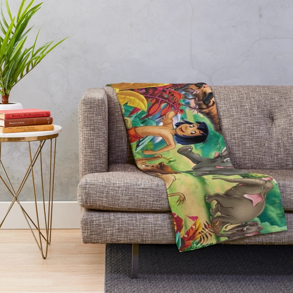Baloo the bear and Mowgli the jungle boy on a cozy plush blanket