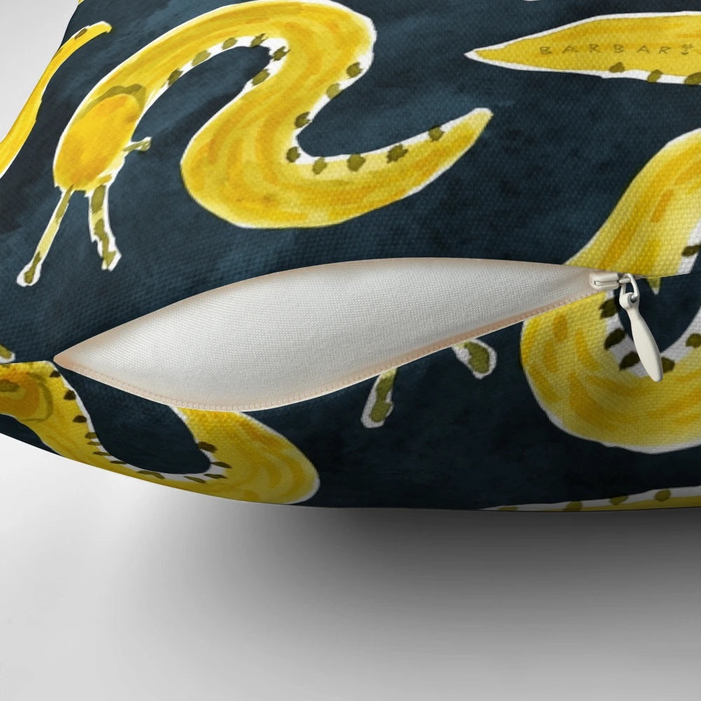 Vibrant yellow banana slug print on a cozy throw pillow for a playful, Pacific Northwest-inspired home accent.