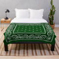 Green plush blanket with bandana-style pattern, perfect for hip hop and urban aesthetics