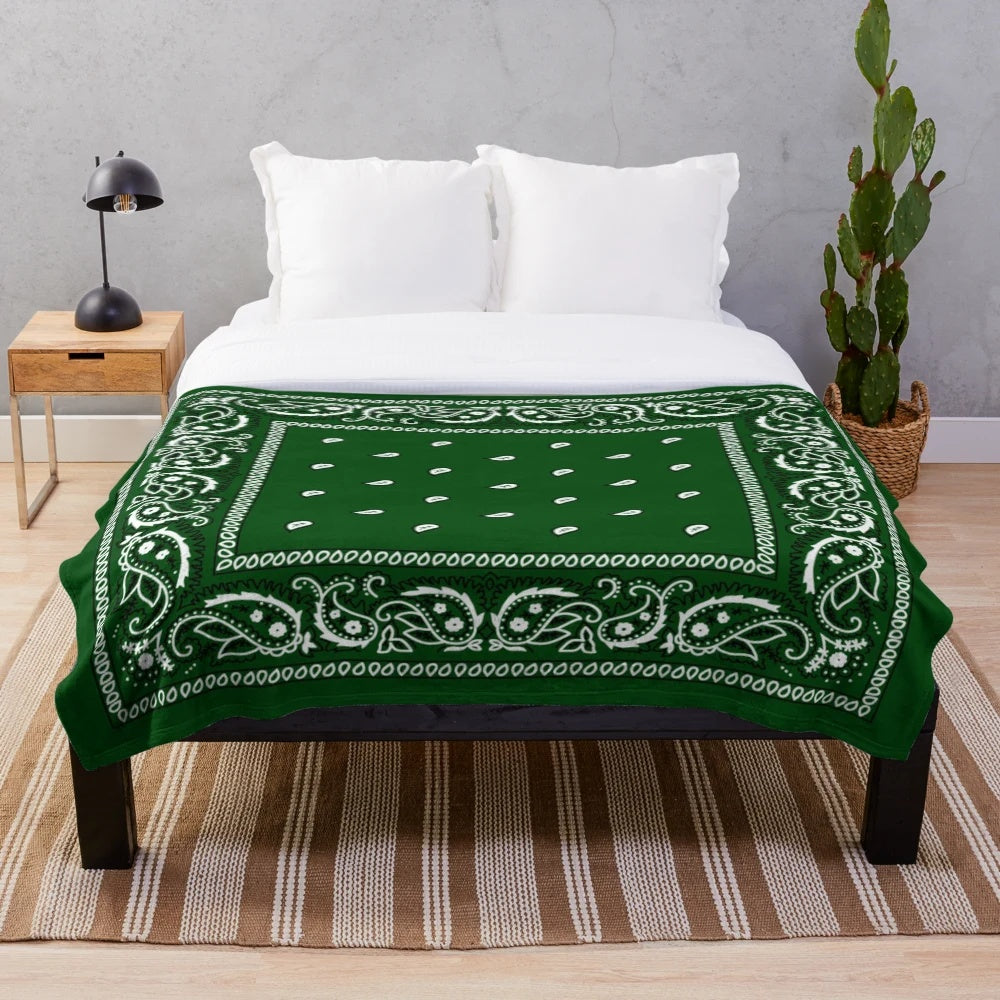Green plush blanket with bandana-style pattern, perfect for hip hop and urban aesthetics