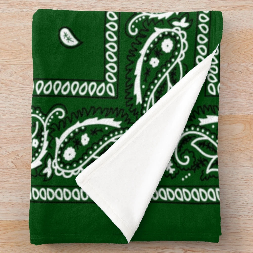 Green plush blanket with bandana-style pattern, perfect for hip hop and urban aesthetics
