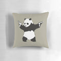 Decorative pillow featuring Banksy's iconic panda graffiti holding guns