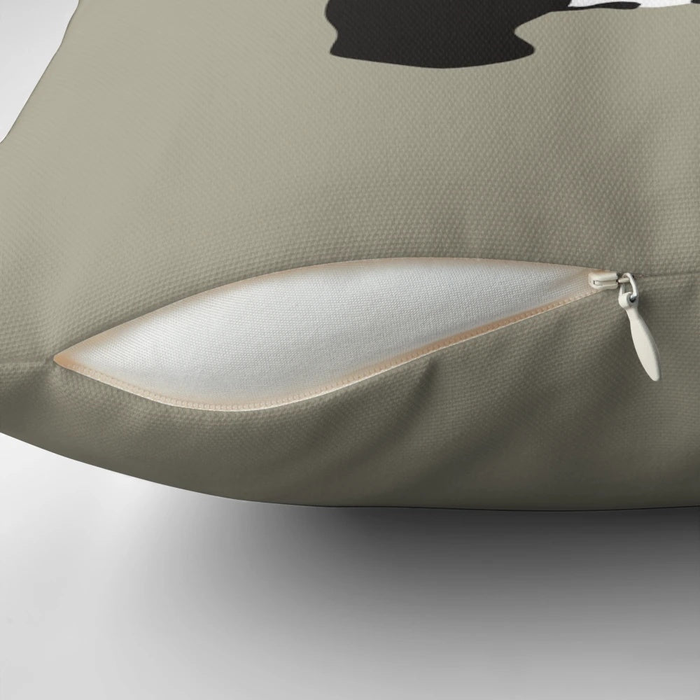 Decorative pillow featuring Banksy's iconic panda graffiti holding guns