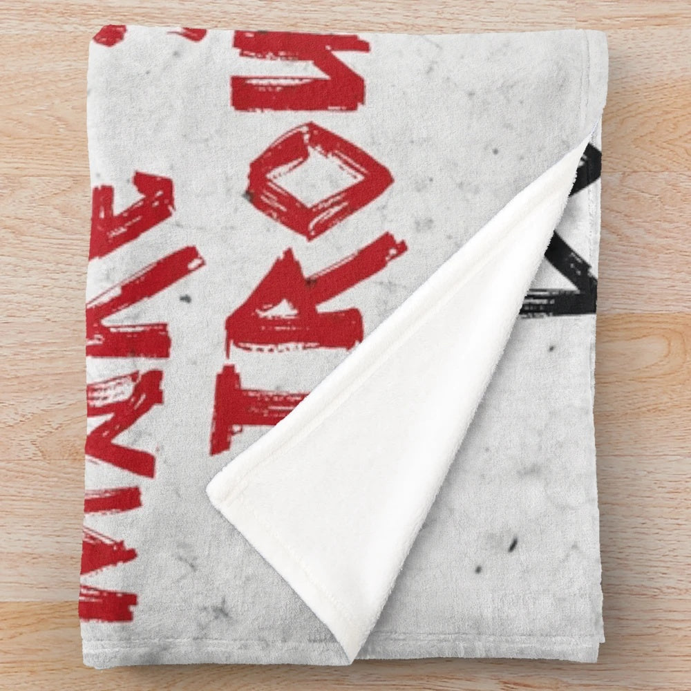 Banksy-inspired plush blanket with anti-capitalist graffiti-style art