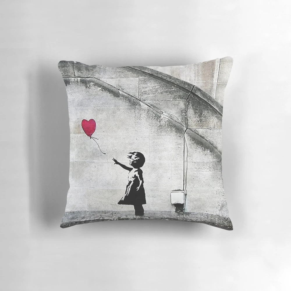 Vibrant and striking Banksy-inspired pillow featuring the iconic "Balloon Girl" mural, symbolizing hope and social commentary.