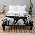 Banksy-inspired plush blanket with dog silhouette shaking off water