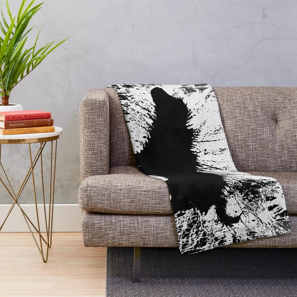 Banksy-inspired plush blanket with dog silhouette shaking off water