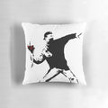 Vibrant pillow featuring the iconic Banksy "Flower Thrower" street art design