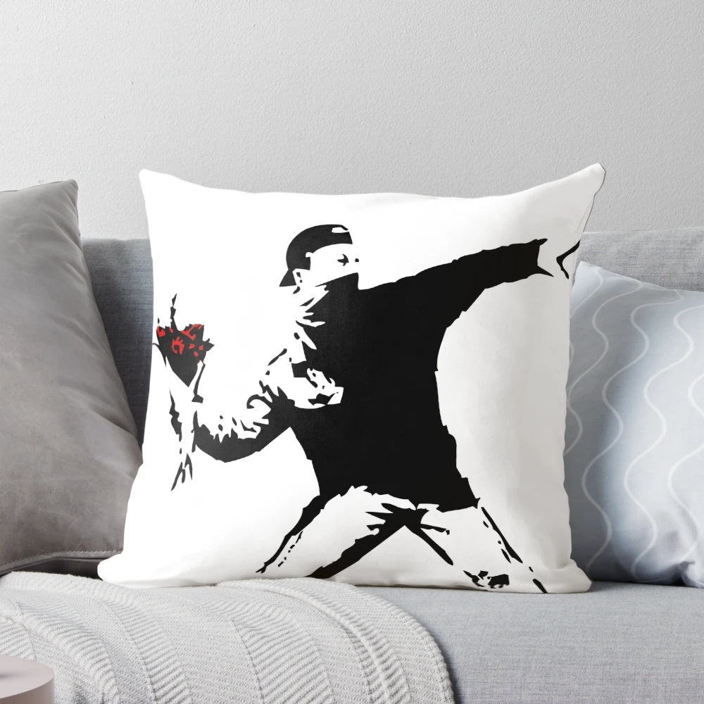Vibrant pillow featuring the iconic Banksy "Flower Thrower" street art design