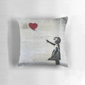 Artistic throw pillow featuring Banksy's iconic Girl with a Red Balloon stencil design