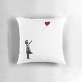 Decorative pillow featuring Banksy's iconic "Girl with Heart Balloon" artwork