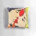 Decorative pillow featuring a Banksy-inspired graffiti art design of two lovers kissing in vibrant colors.
