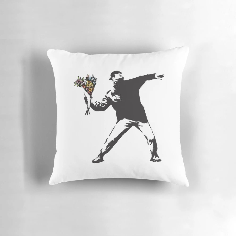 Banksy-inspired throw pillow design featuring a person throwing flowers instead of a Molotov cocktail, symbolizing peaceful protest