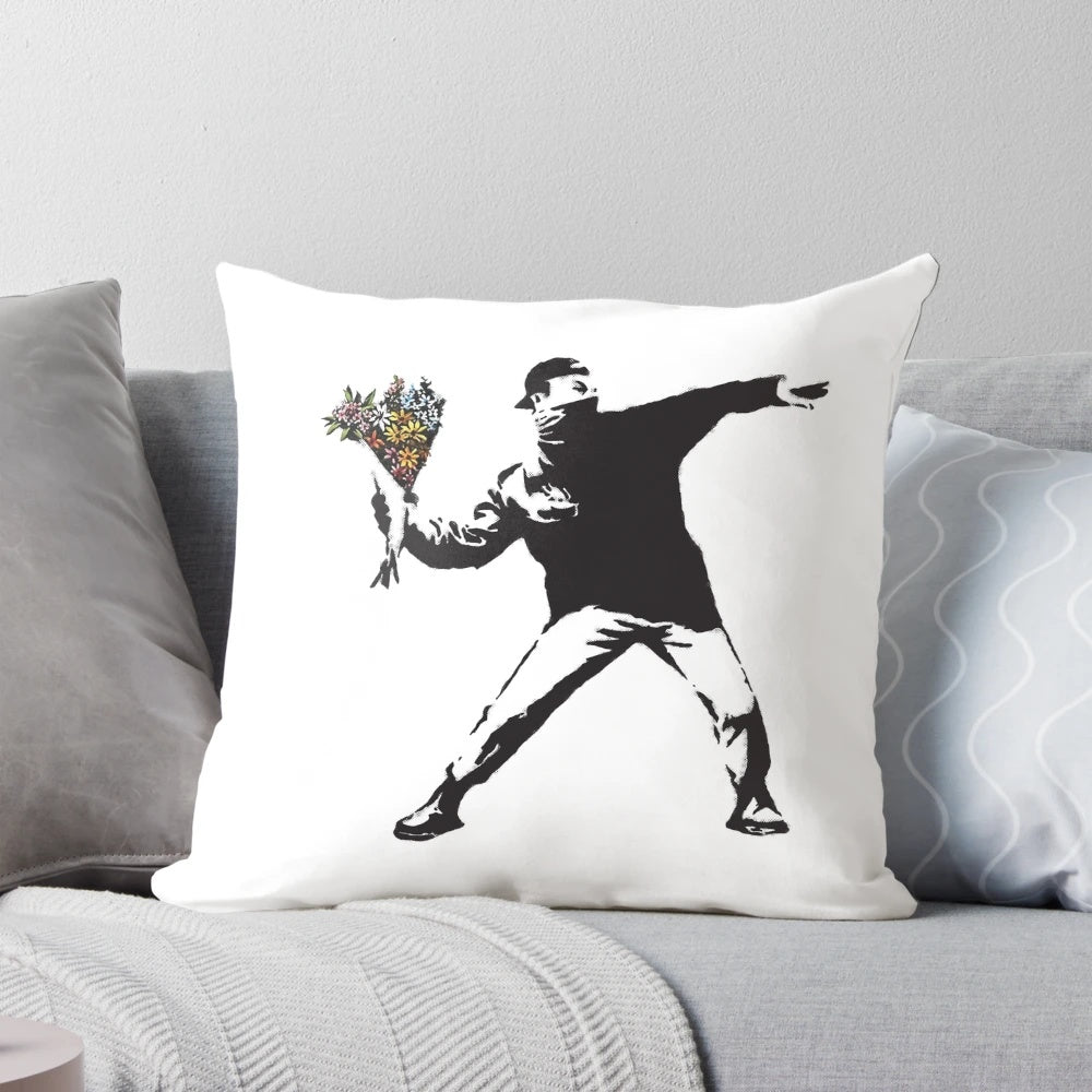Banksy-inspired throw pillow design featuring a person throwing flowers instead of a Molotov cocktail, symbolizing peaceful protest