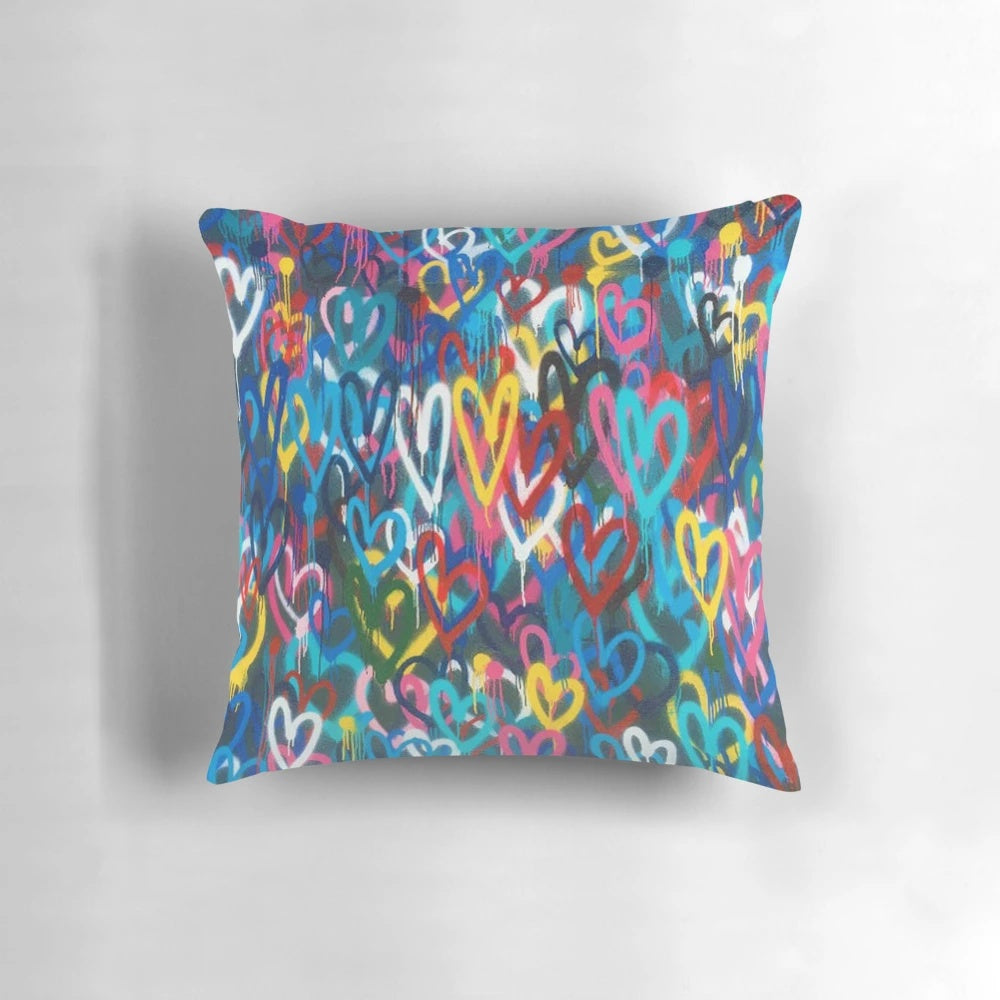 Banksy-inspired love hearts graffiti design printed on a high-quality pillow