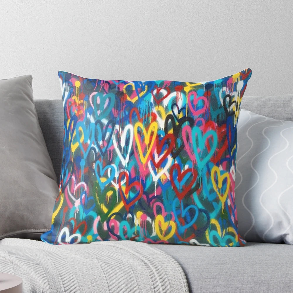 Banksy-inspired love hearts graffiti design printed on a high-quality pillow