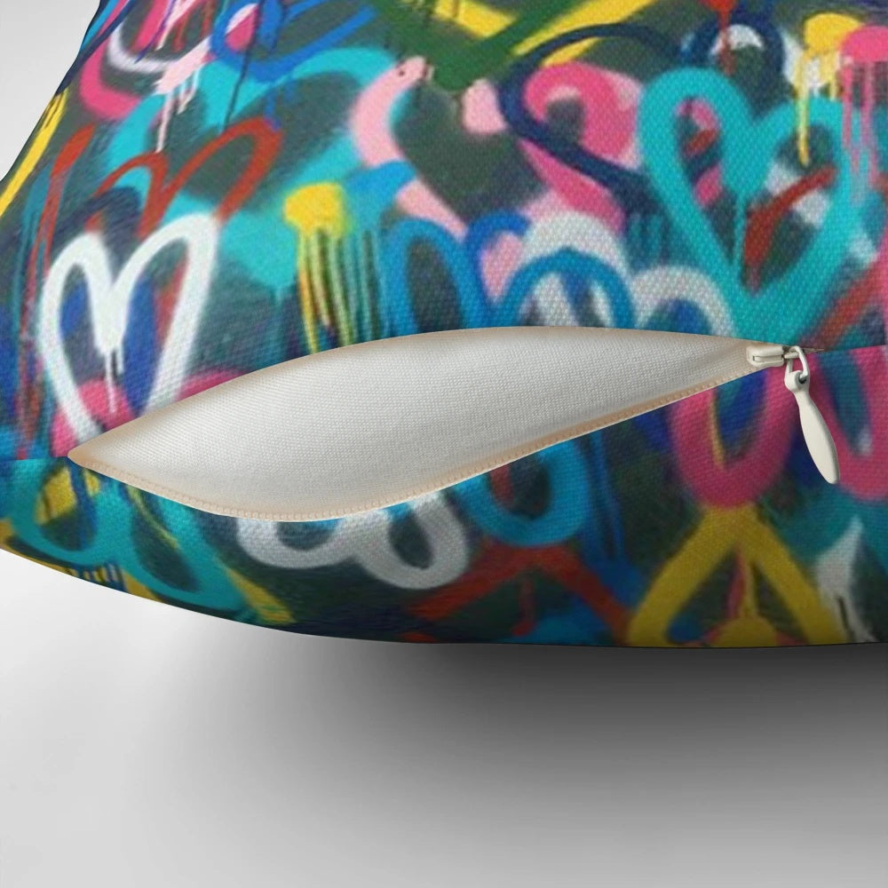 Banksy-inspired love hearts graffiti design printed on a high-quality pillow