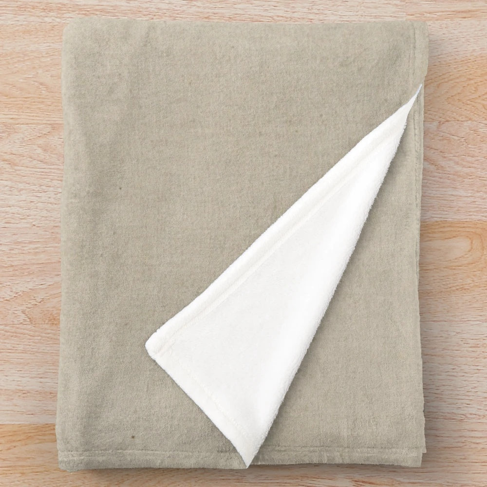Banksy-inspired plush blanket featuring a monkey detonator design