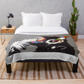 Banksy-inspired plush blanket featuring a monkey DJ with headphones