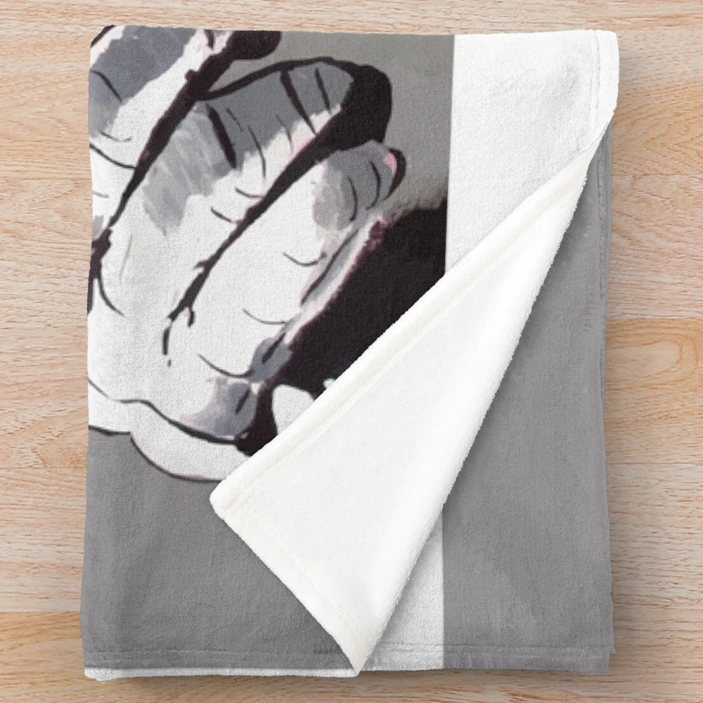 Banksy-inspired plush blanket featuring a monkey DJ with headphones