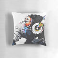 An image of a Banksy-inspired white pillow featuring a monkey wearing headphones and appearing to be deep in thought.