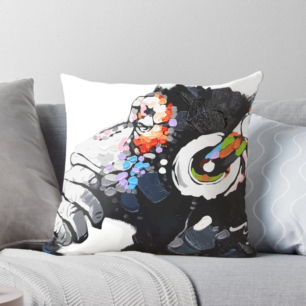 An image of a Banksy-inspired white pillow featuring a monkey wearing headphones and appearing to be deep in thought.