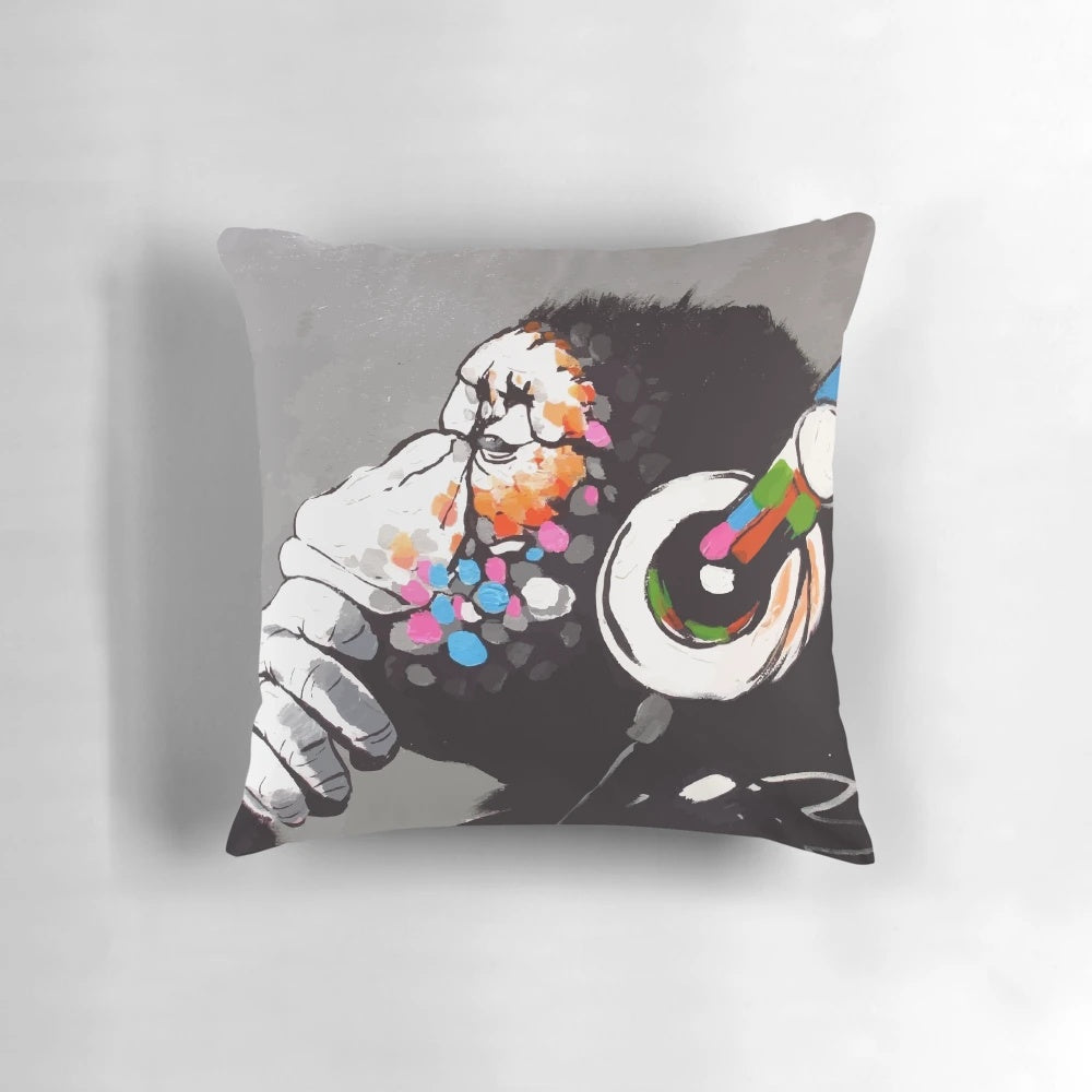 Banksy-inspired pillow featuring a monkey thinker wearing headphones