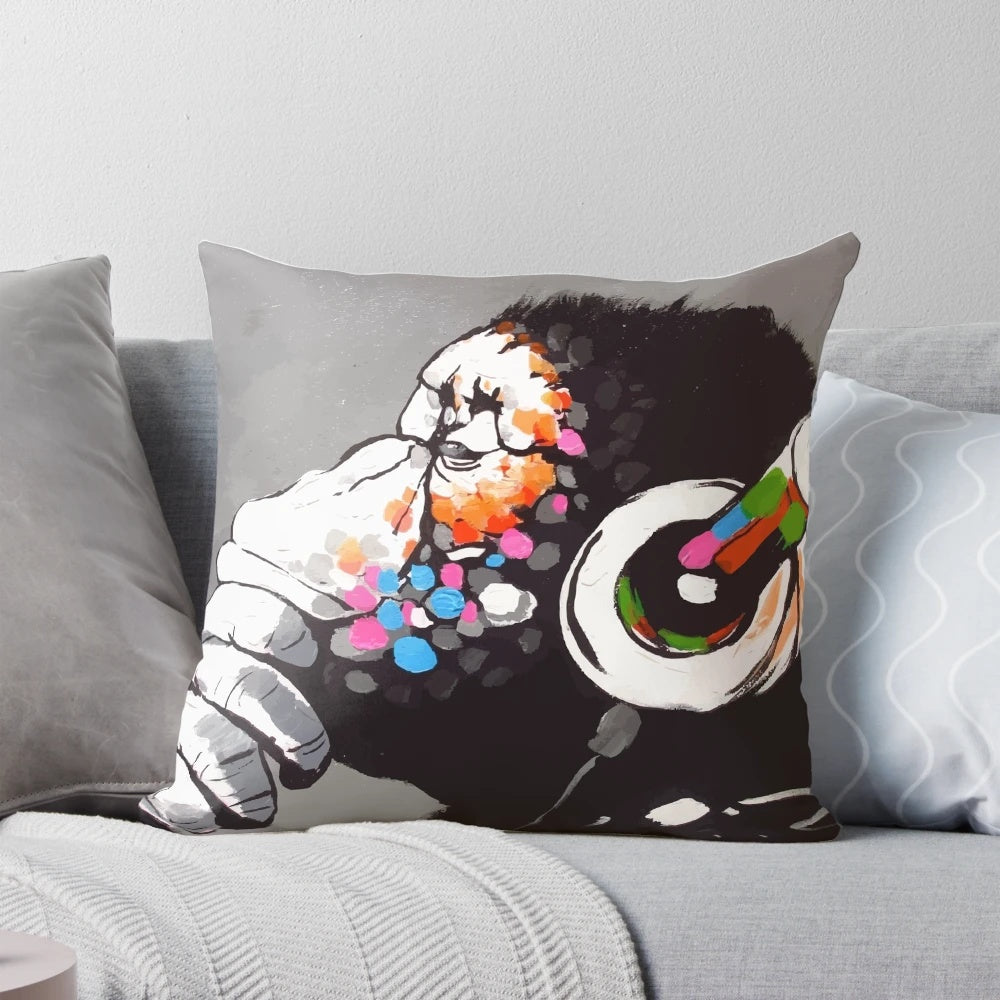 Banksy-inspired pillow featuring a monkey thinker wearing headphones