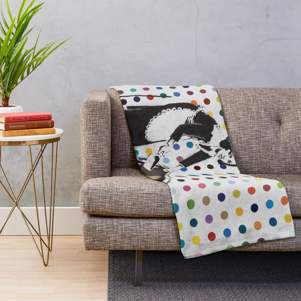 Banksy-inspired plush blanket featuring graffiti-style artwork