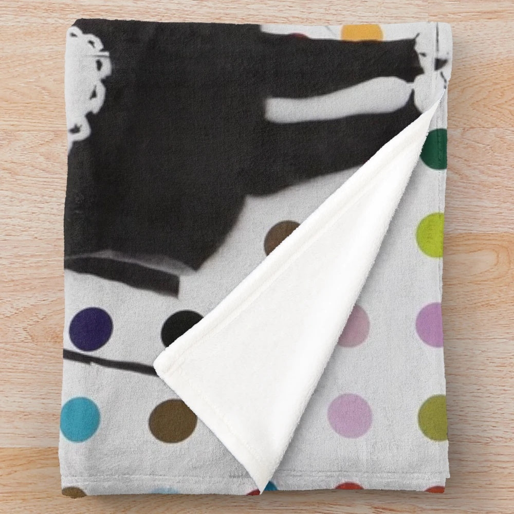 Banksy-inspired plush blanket featuring graffiti-style artwork