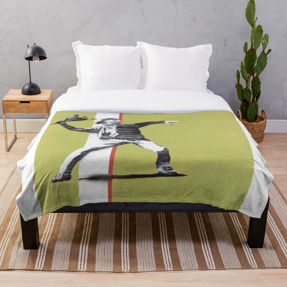 Riot green plush blanket with Banksy-style flower thrower design