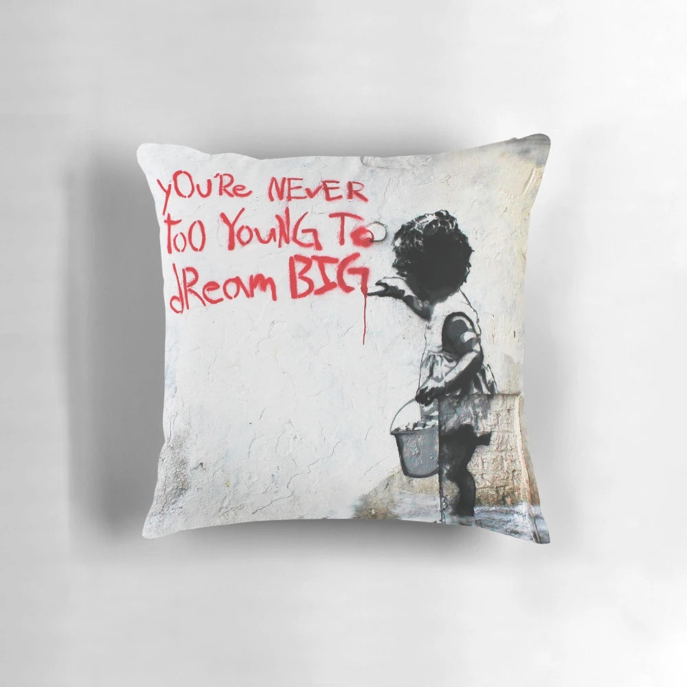 Vibrant and inspiring Banksy-style street art pillow featuring a quote to "Dream Big
