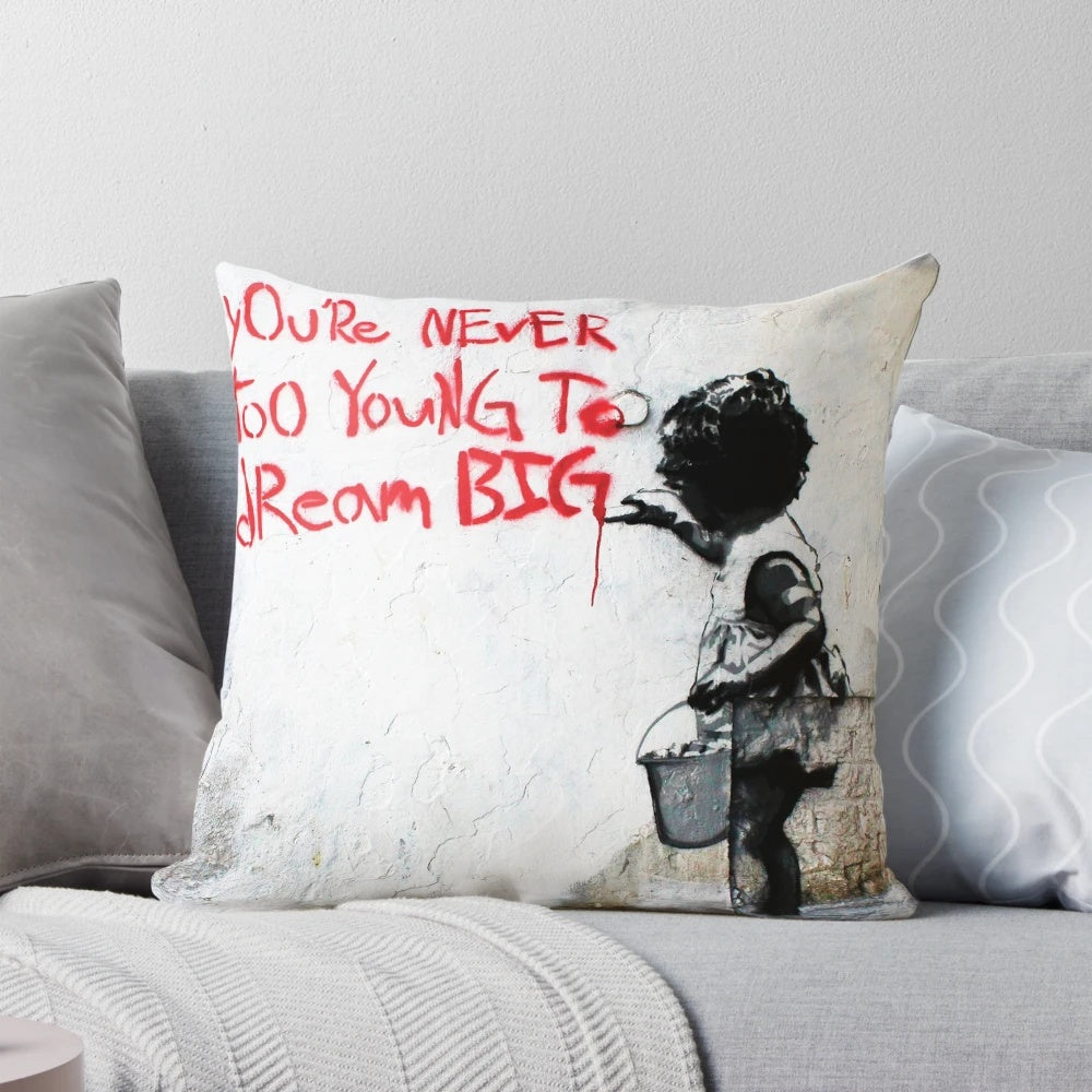 Vibrant and inspiring Banksy-style street art pillow featuring a quote to "Dream Big