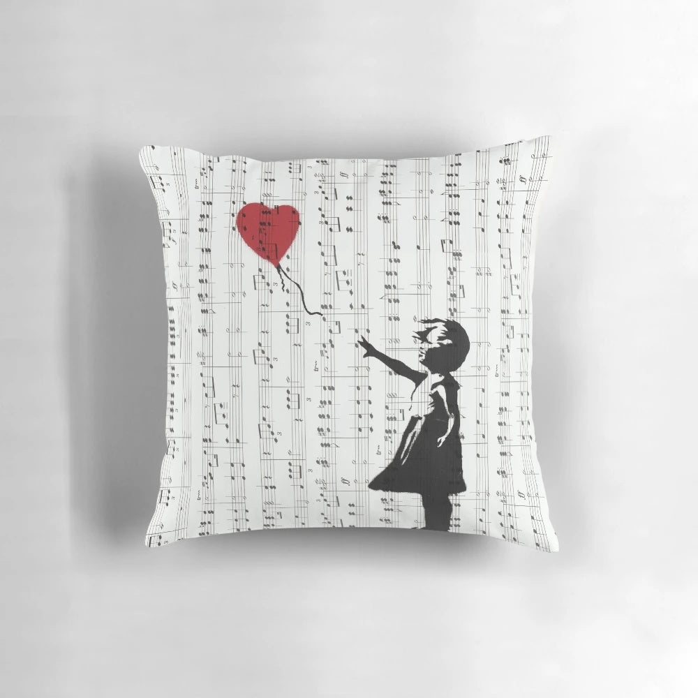Colorful contemporary street art pillow featuring Banksy's iconic 'Girl With a Red Balloon' design