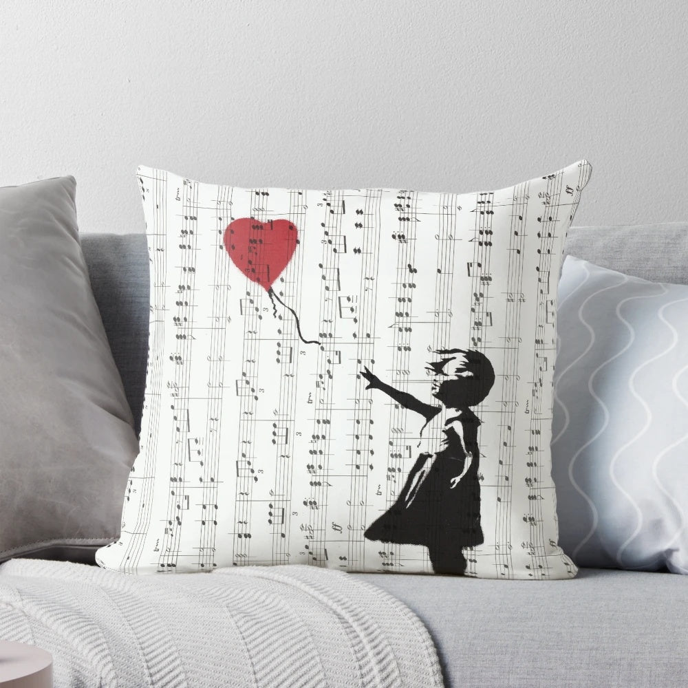 Colorful contemporary street art pillow featuring Banksy's iconic 'Girl With a Red Balloon' design