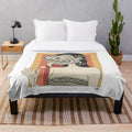 Barong-inspired plush blanket featuring traditional Balinese art